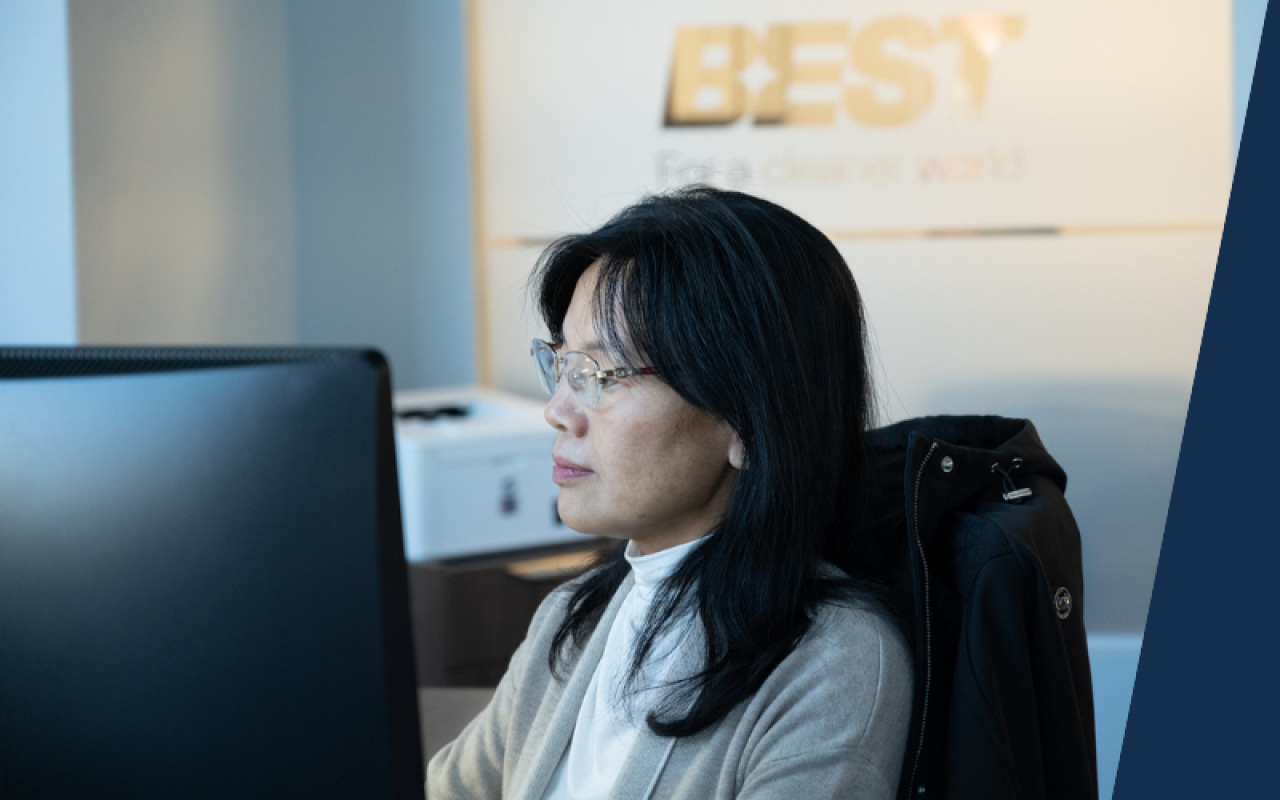 Team member focused on working at a computer.