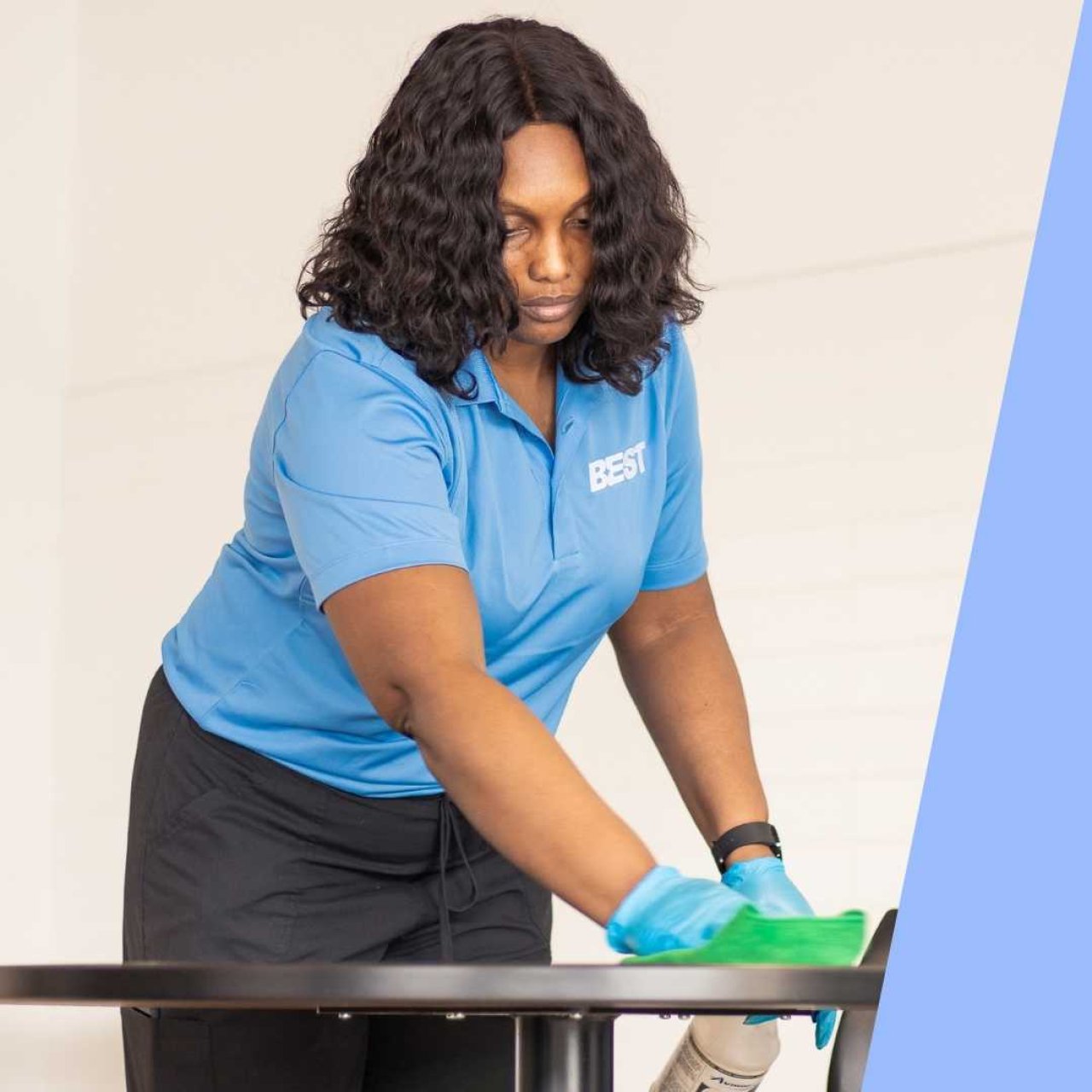 Team member cleaning a table.