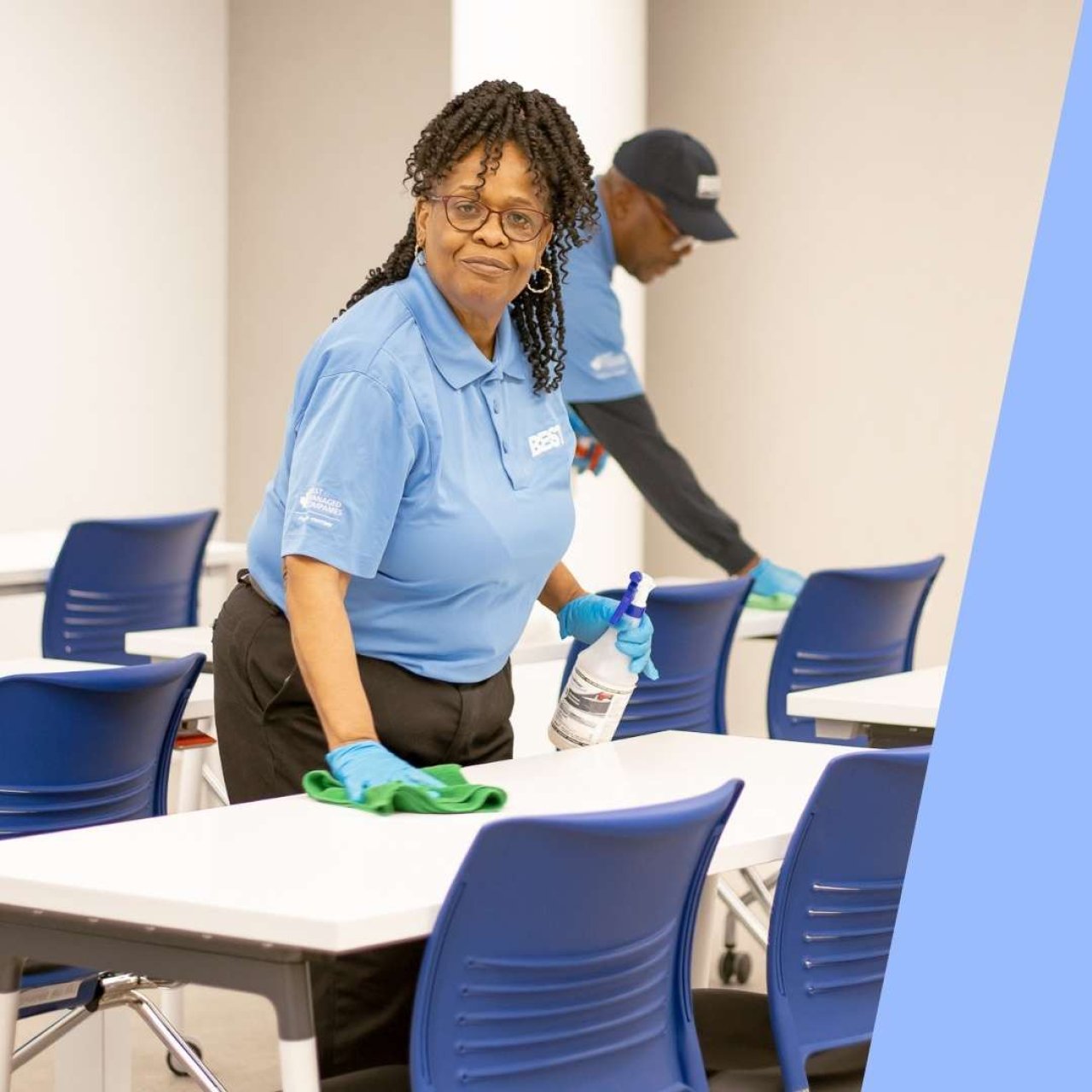 Team member cleaning a classroom.