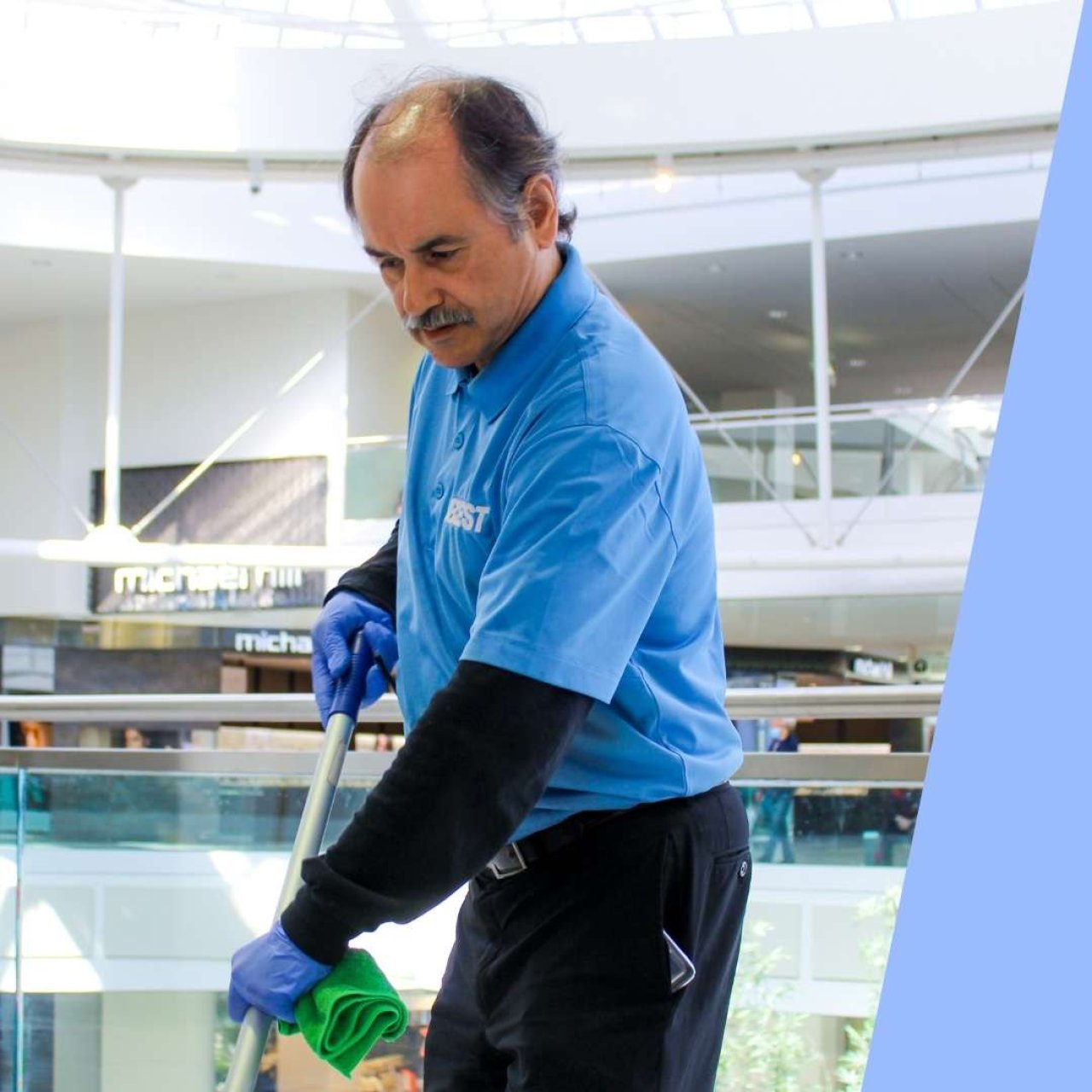 Team member cleaning a mall.