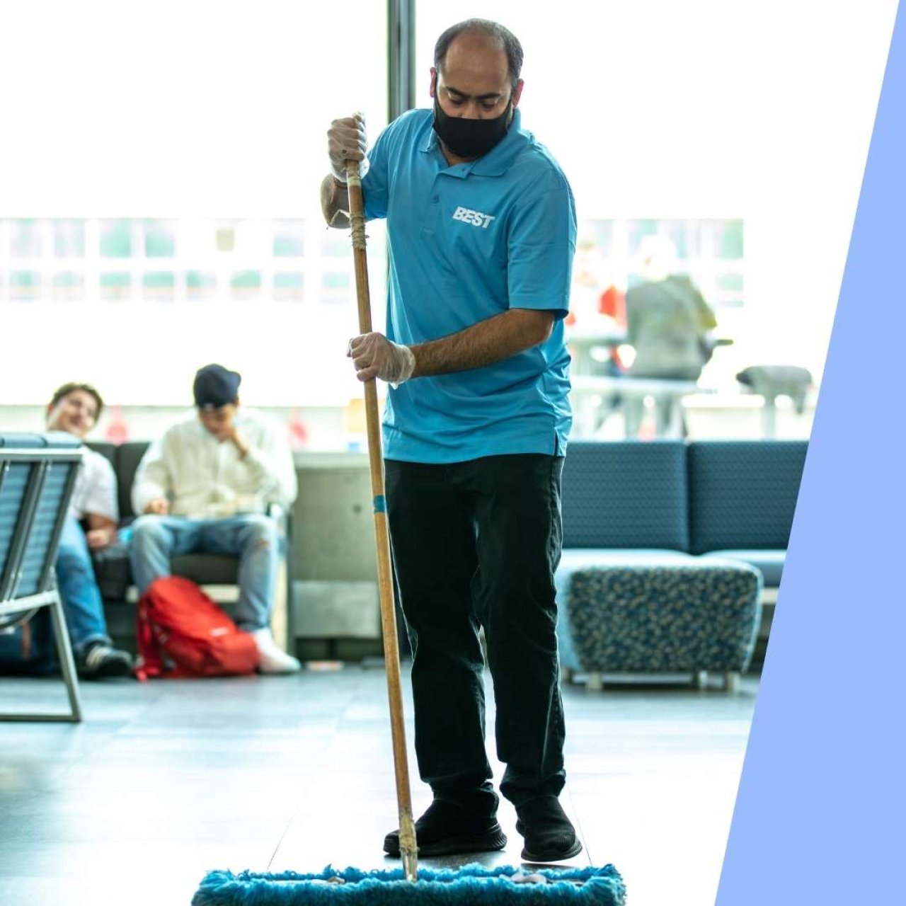 Team member mopping the floor.