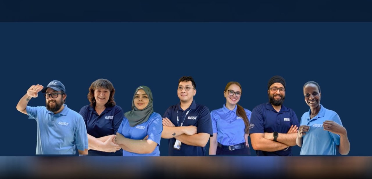 Company banner showcasing team members.