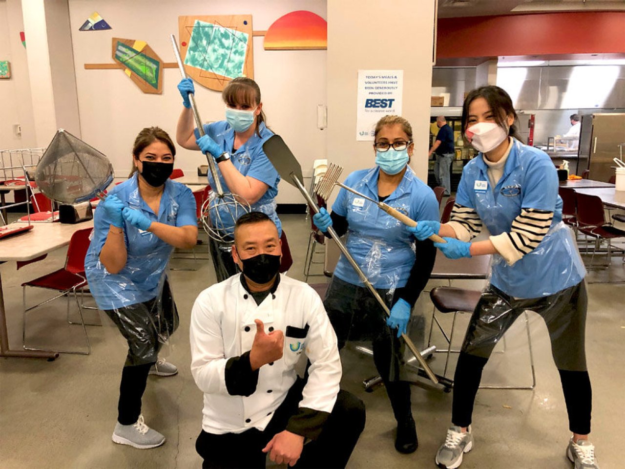 BEST group members actively helping at a volunteer event.